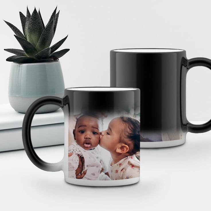 Small black magic mug with printed design