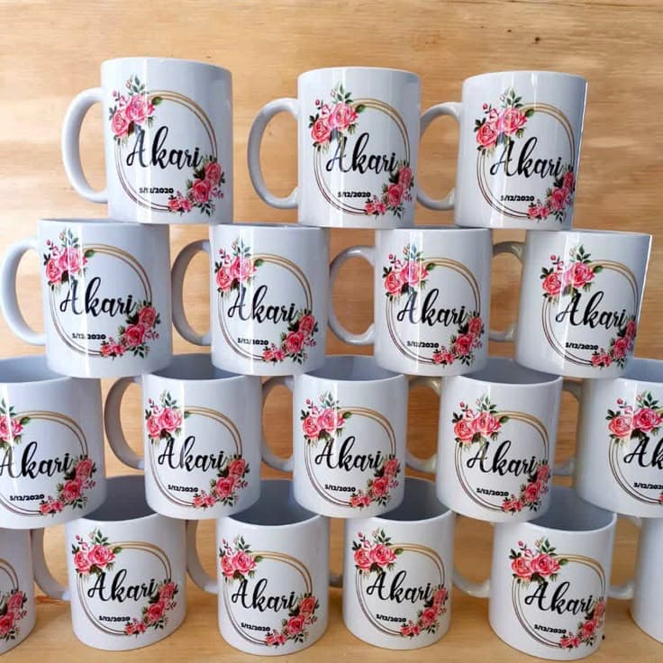 Small white ceramic mug with printed design